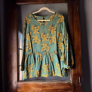 Lightweight floral blouse with peplum style bottom